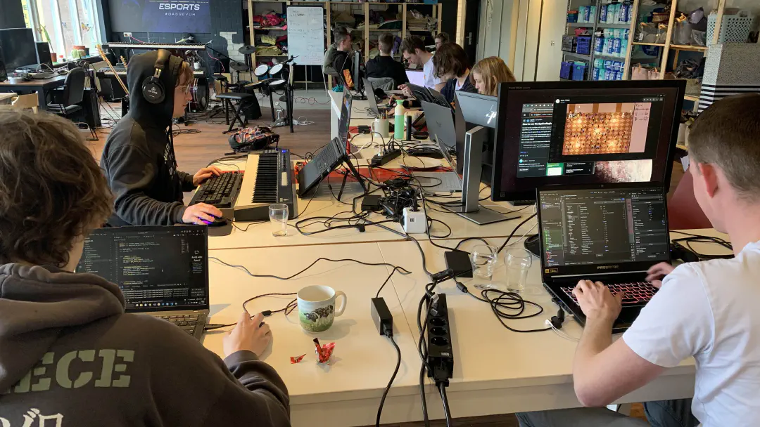 Photograph taken during the global game jam. Jammers are working hard behind their computers