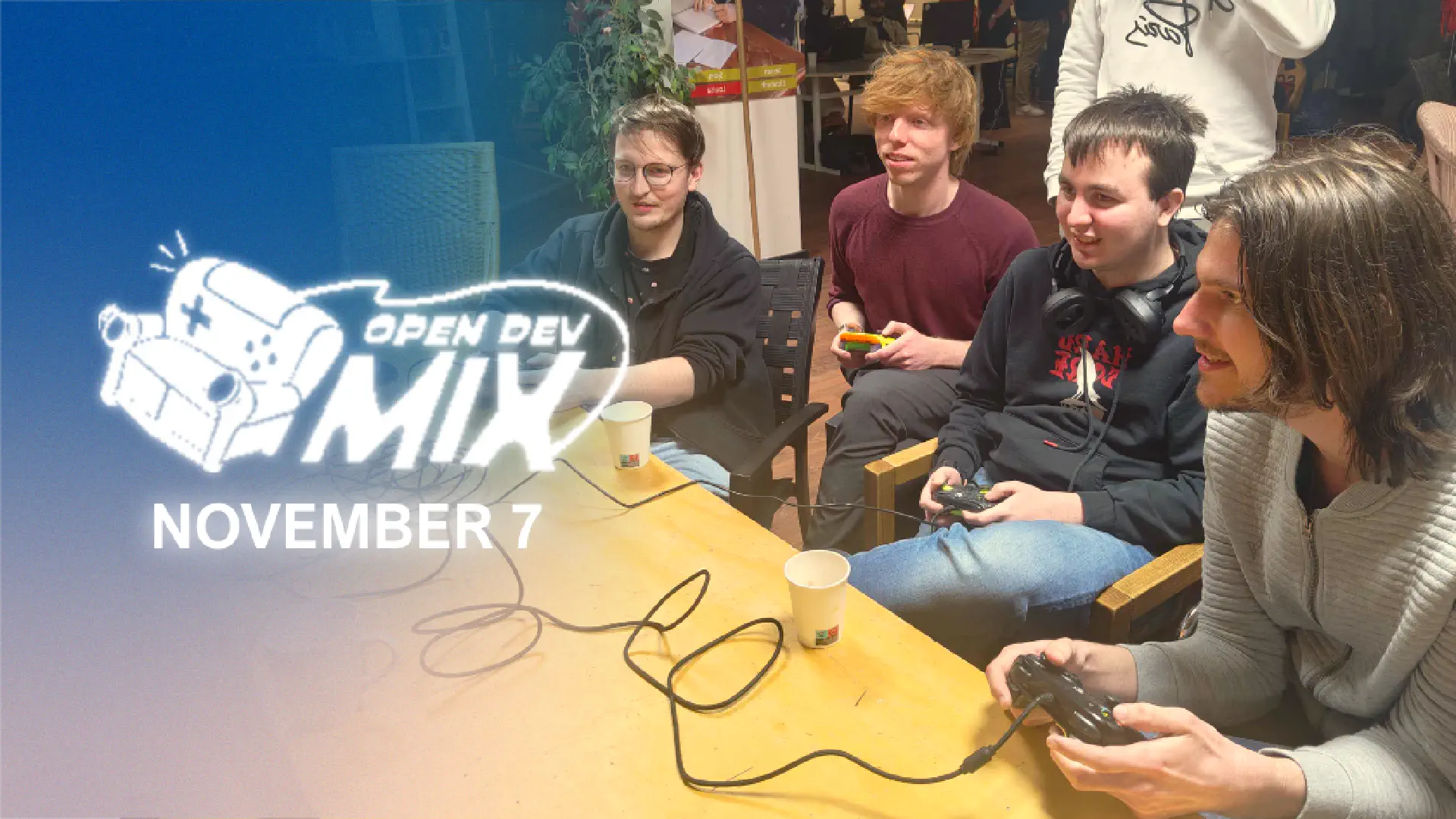 Photograph taken during a previous Open Dev Mix. People are focussing on a game they're playing!